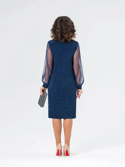 Back view of Celeste Midi Dress with sheer sleeves, shimmery navy fabric, perfect for weddings and formal events.
