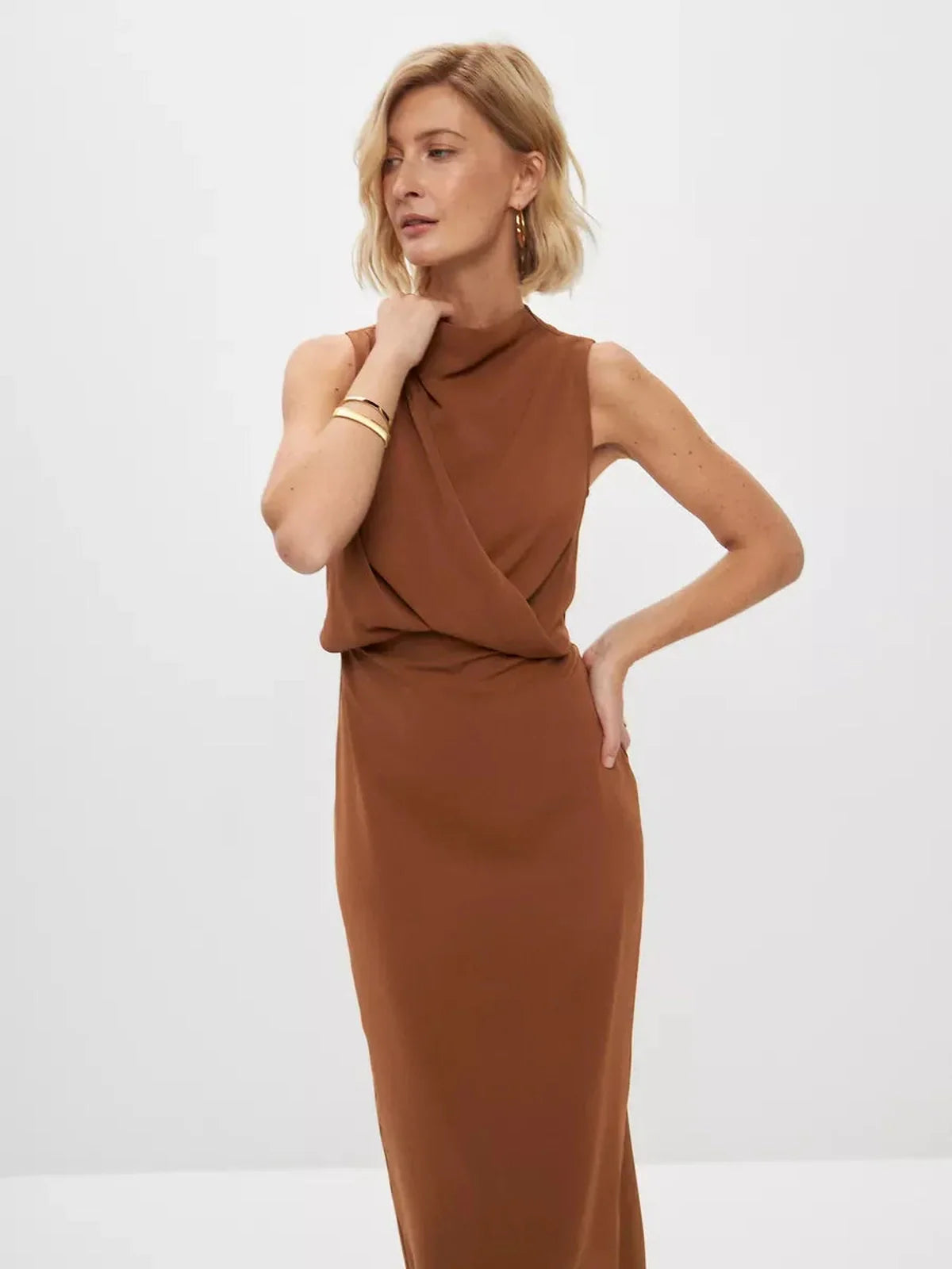 Model showcasing a warm light brown Sculpted Drape Maxi Dress, ideal for formal occasions and elegant events.