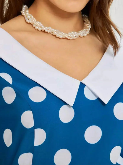Close-up of the Pearl Dot Midi Dress featuring a white collar and oversized polka dots in dark teal.