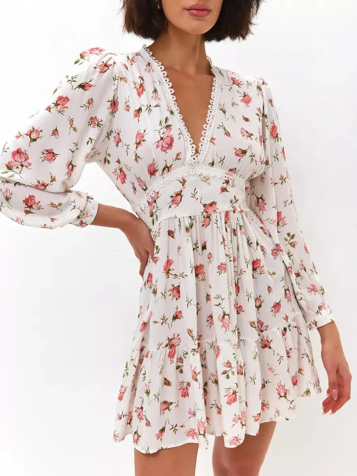 Rose Whimsy Mini Dress featuring floral print, lace trim, and ruffles, perfect for summer parties and elegant events.