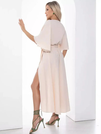 Back view of the Serenity Midi Dress featuring flared sleeves and a high side slit, perfect for weddings and formal events.