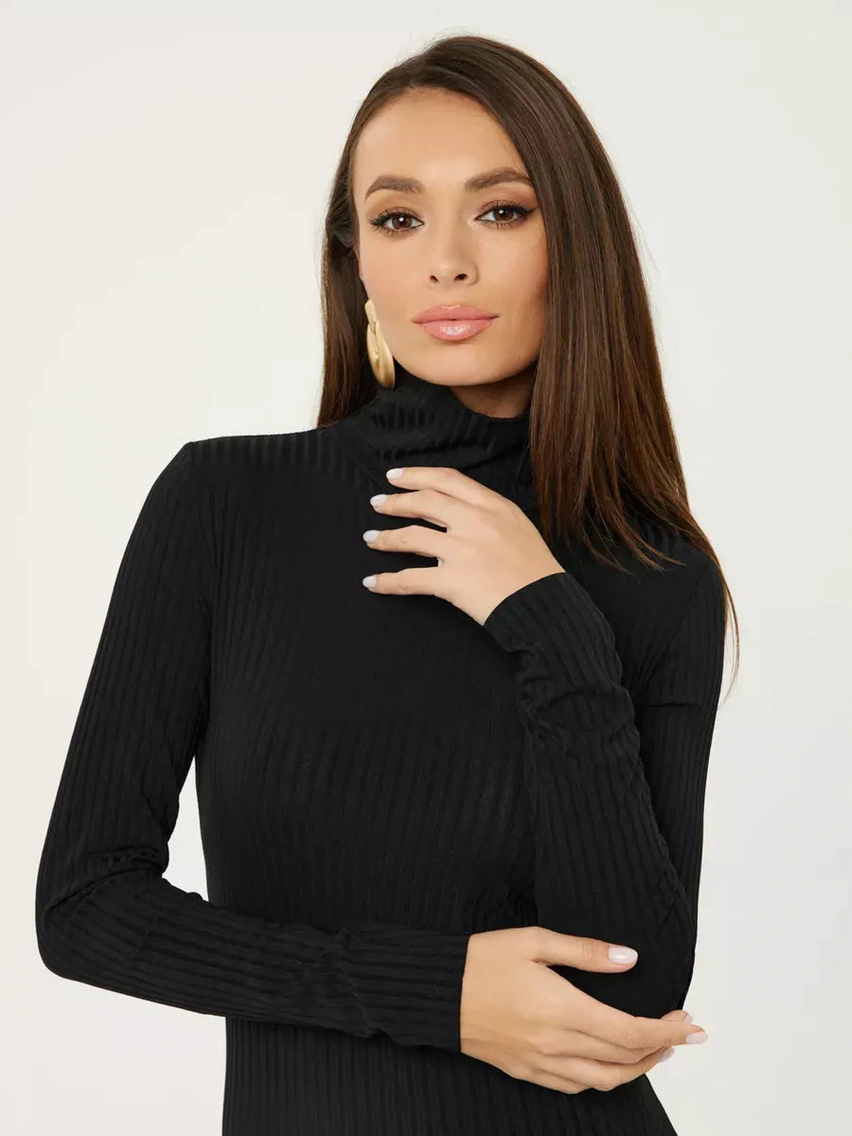Close-up of a model showcasing the sleek black ribbed long sleeve turtleneck from the Sculpted Rib Midi Dress.