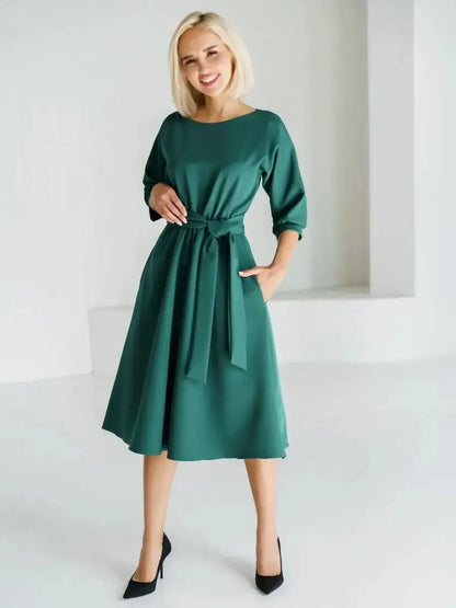 Emerald Aura Midi Dress featuring a belted waist and A-line silhouette, perfect for weddings and formal occasions.