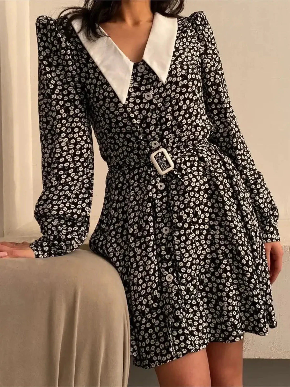 Vintage Charm Mini Dress featuring an elegant floral design, bold collar, and cinched waist, ideal for summer or formal occasions.