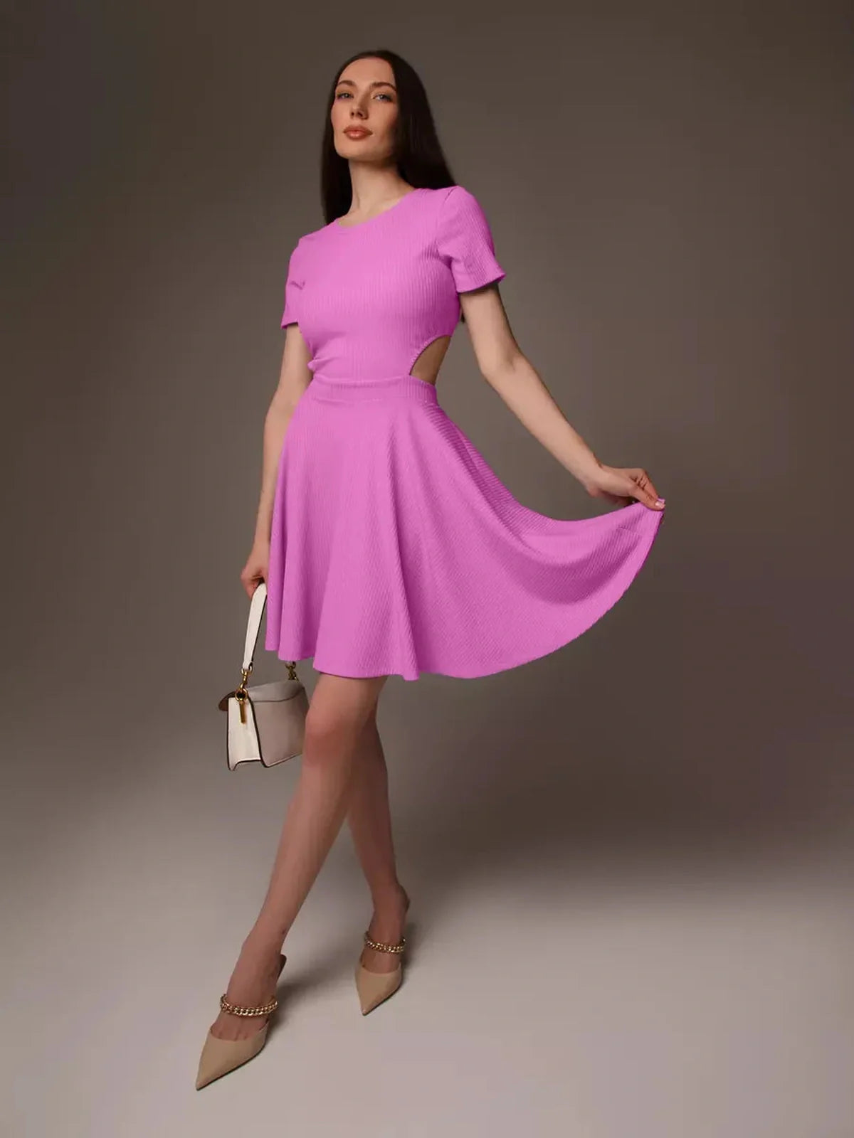 Model showcasing a playful pink Cutout Charm Mini Dress with flared skirt and open waist detail, perfect for summer events.