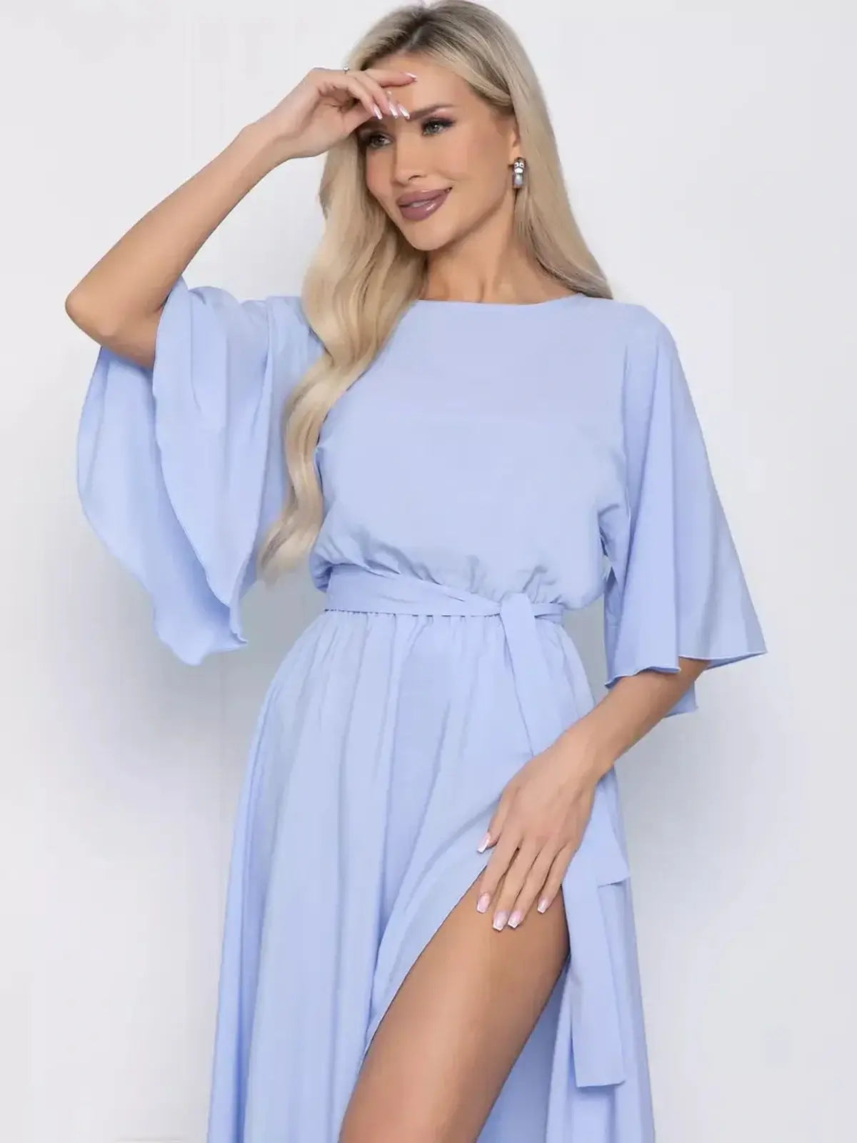 Celeste Midi Dress featuring graceful flutter sleeves in light blue, perfect for summer events, wedding guest, and parties.