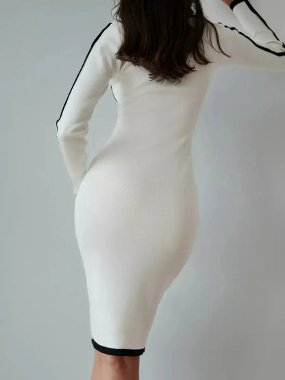 Back view of a Framed Elegance Midi Dress in white with black piping, showcasing a form-fitting, sophisticated silhouette.