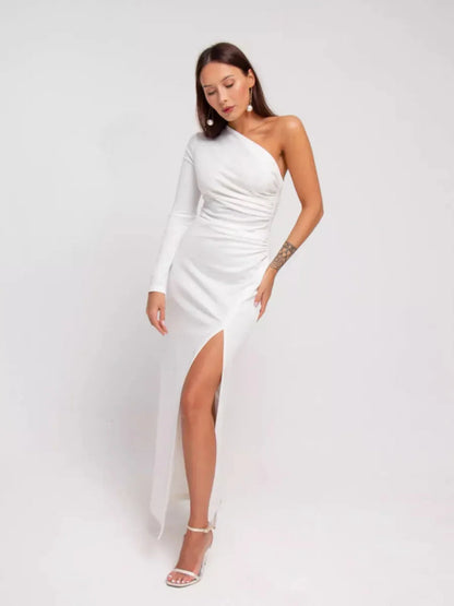 Elegant one-shoulder Celeste Maxi Dress in white with draped details and high side slit for formal occasions.