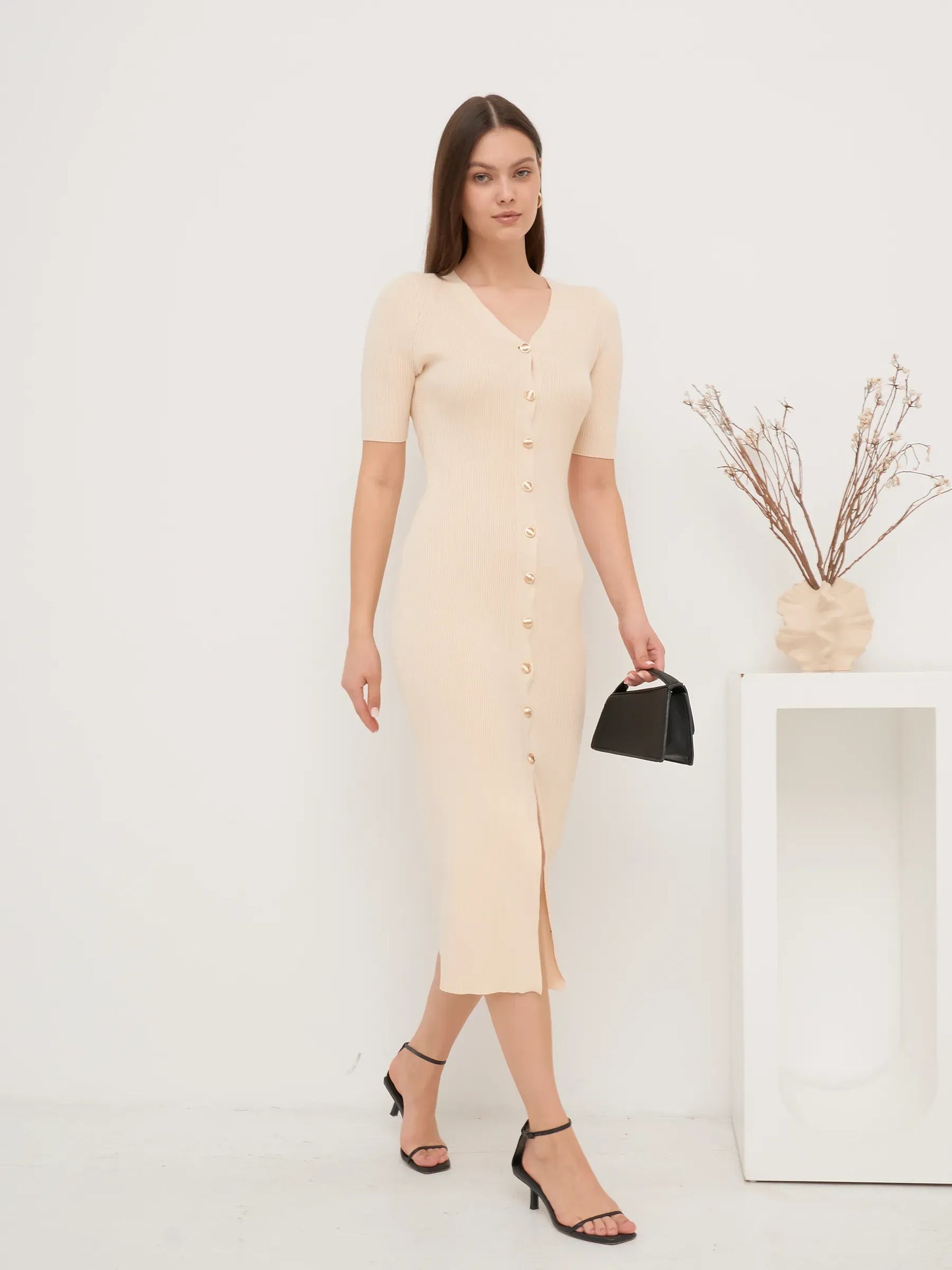 Elegant pearl knit midi dress with fitted silhouette and gold buttons, perfect for summer outings and special occasions.
