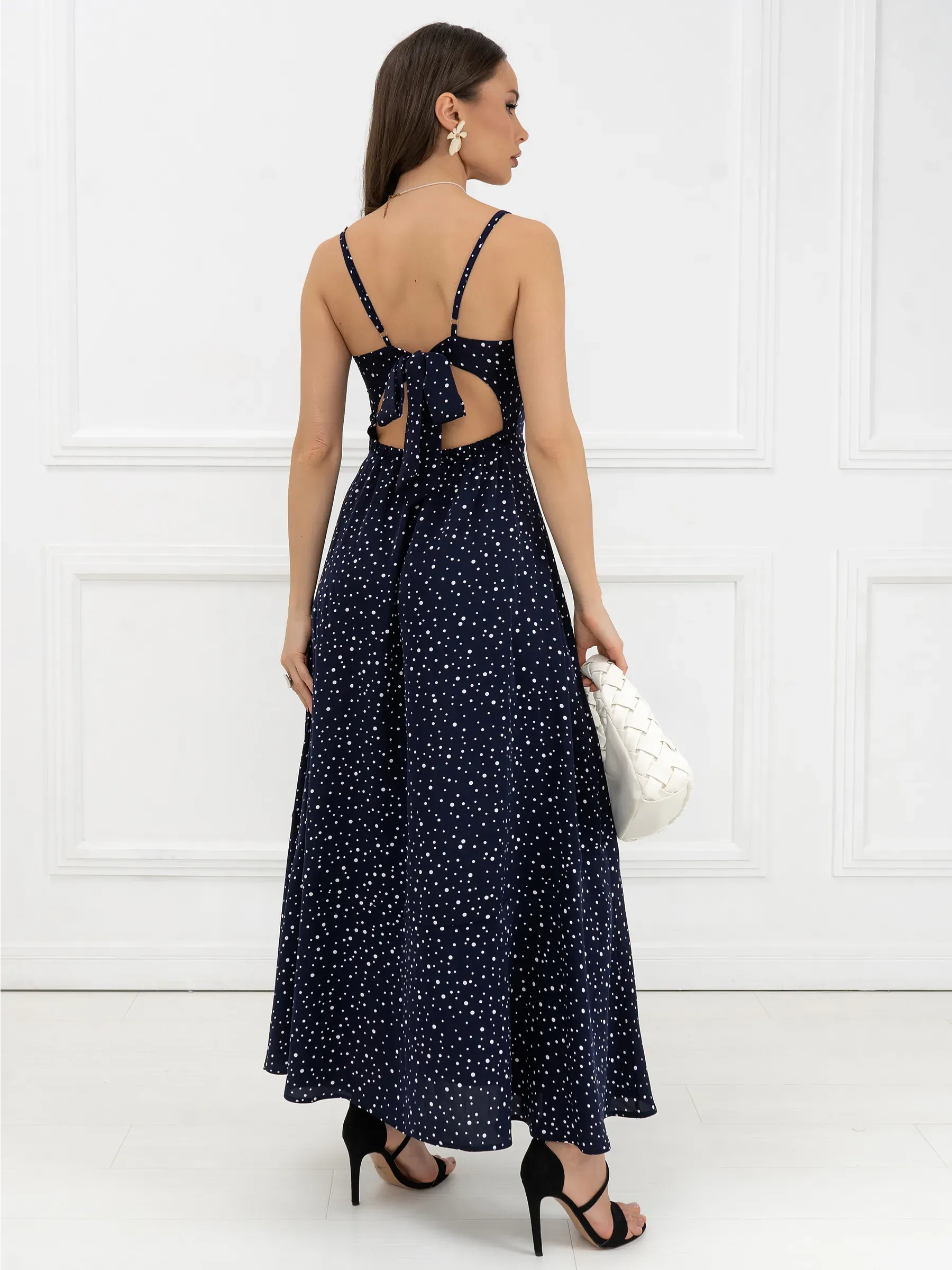 Back view of the Noir Dots Maxi Dress featuring a tie-back design, perfect for summer weddings and formal events.