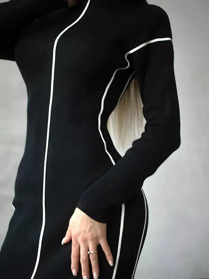 Sculpted Line Midi Dress in black with white contrast stripes, highlighting a figure-flattering silhouette perfect for various occasions.
