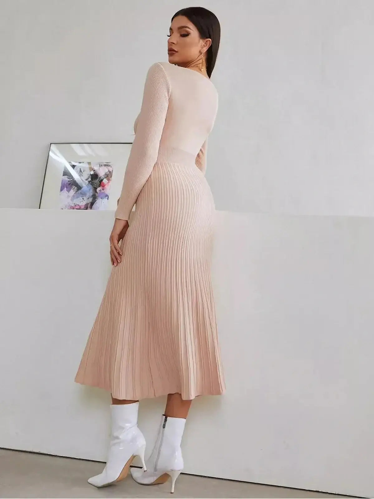 Elegant blush midi dress with a pleated skirt, perfect for weddings, cocktail parties, and summer events.