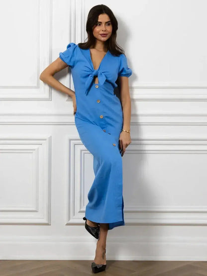 Maxi Dress Azure Charm featuring a V-neckline, tie-front detail, and buttons, perfect for summer and wedding guest occasions.