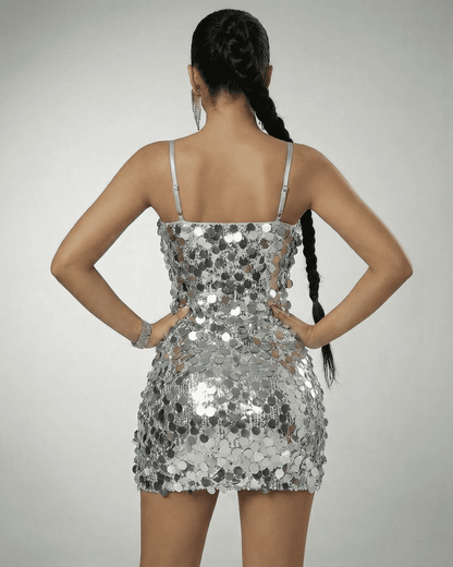 Stella Mini Dress by Slimona, silver sequin off-the-shoulder mini dress featuring a high waist and structured silhouette.