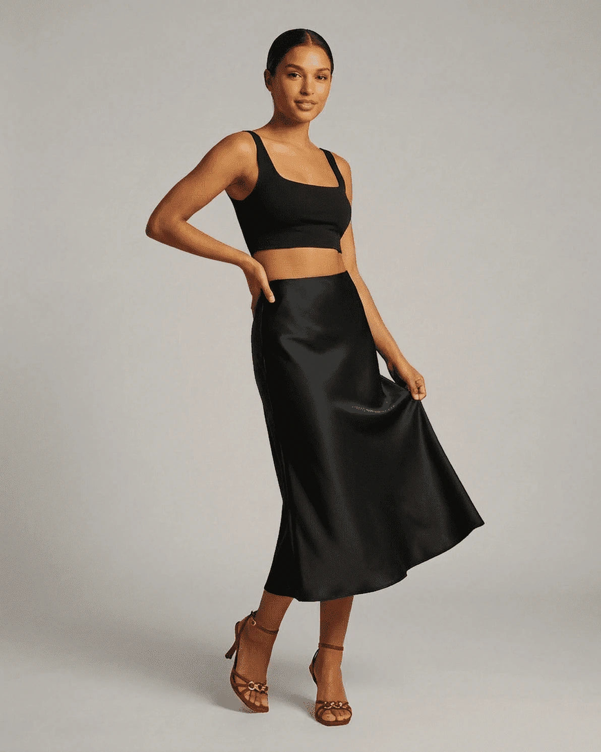 Noirelle Midi Skirt – Black Satin midi skirt, side view by Slimona