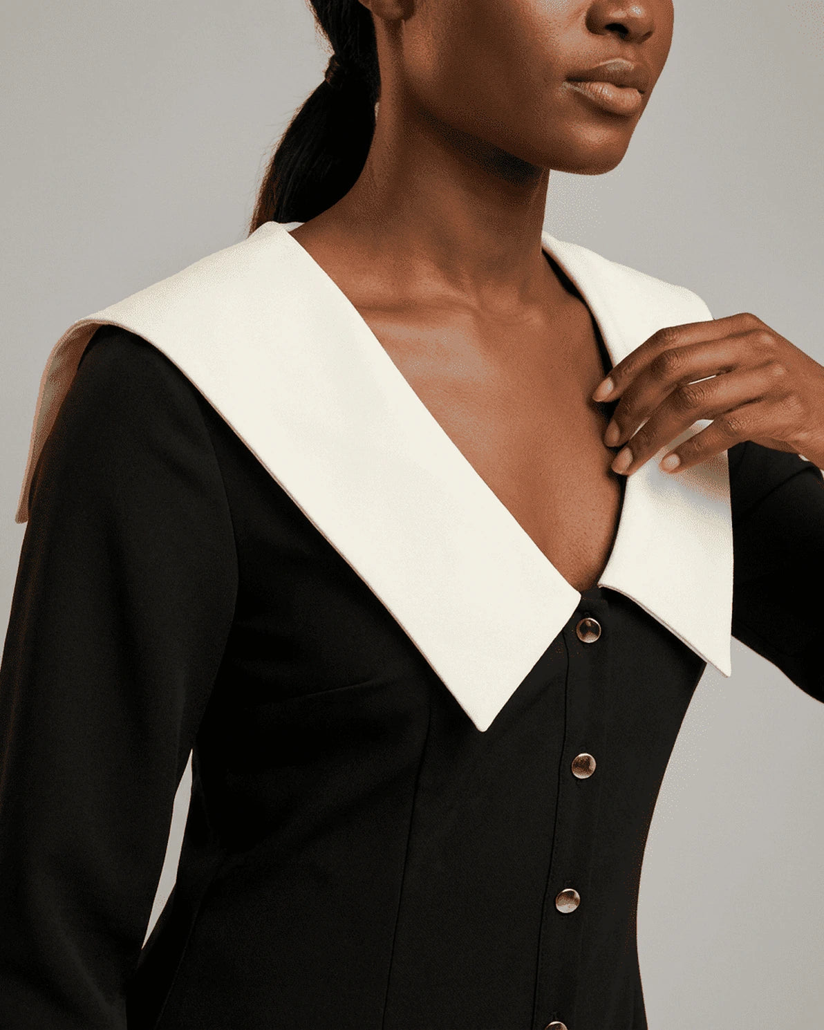 Corinne Mini Dress – Black V Neck mini dress, back view by Slimona