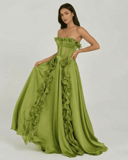 Stunning model wearing the Verdessa Maxi Dress by Slimona, a strapless green dress with ruffle detail.