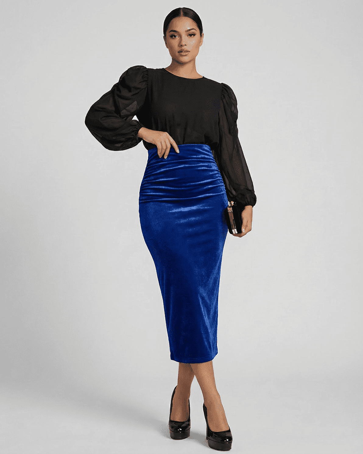 Model wearing Azure Midi Skirt by Slimona, a high-waisted velvet pencil skirt in deep blue with elegant back slit.