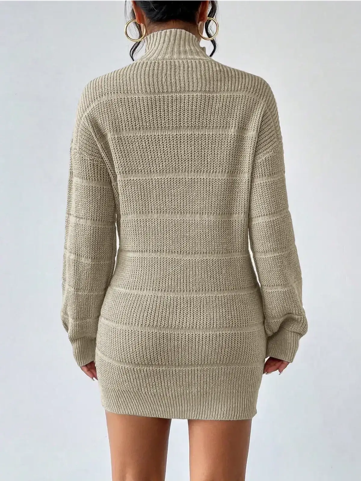 Beige ribbed knit mini dress with mock neck and long sleeves, perfect for cool-weather occasions.