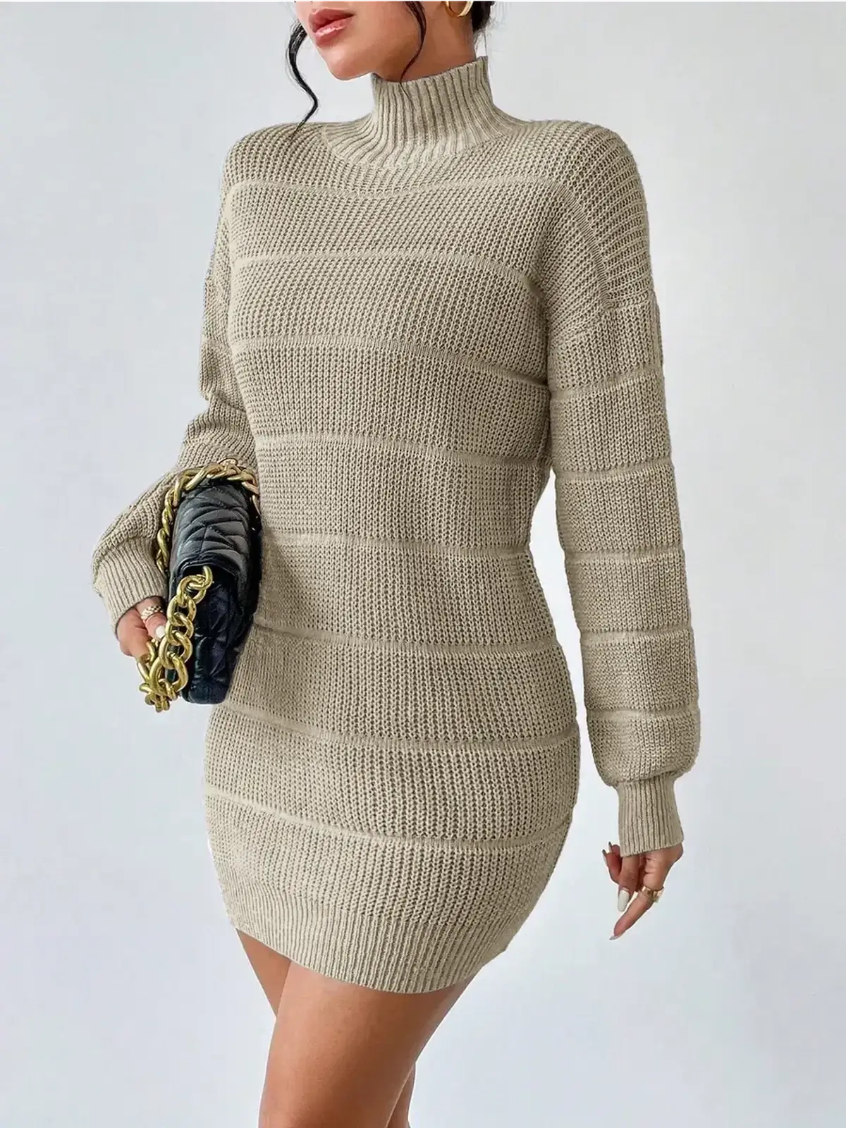 Beige knit mini dress with long sleeves and mock neck, perfect for cool weather fashion.