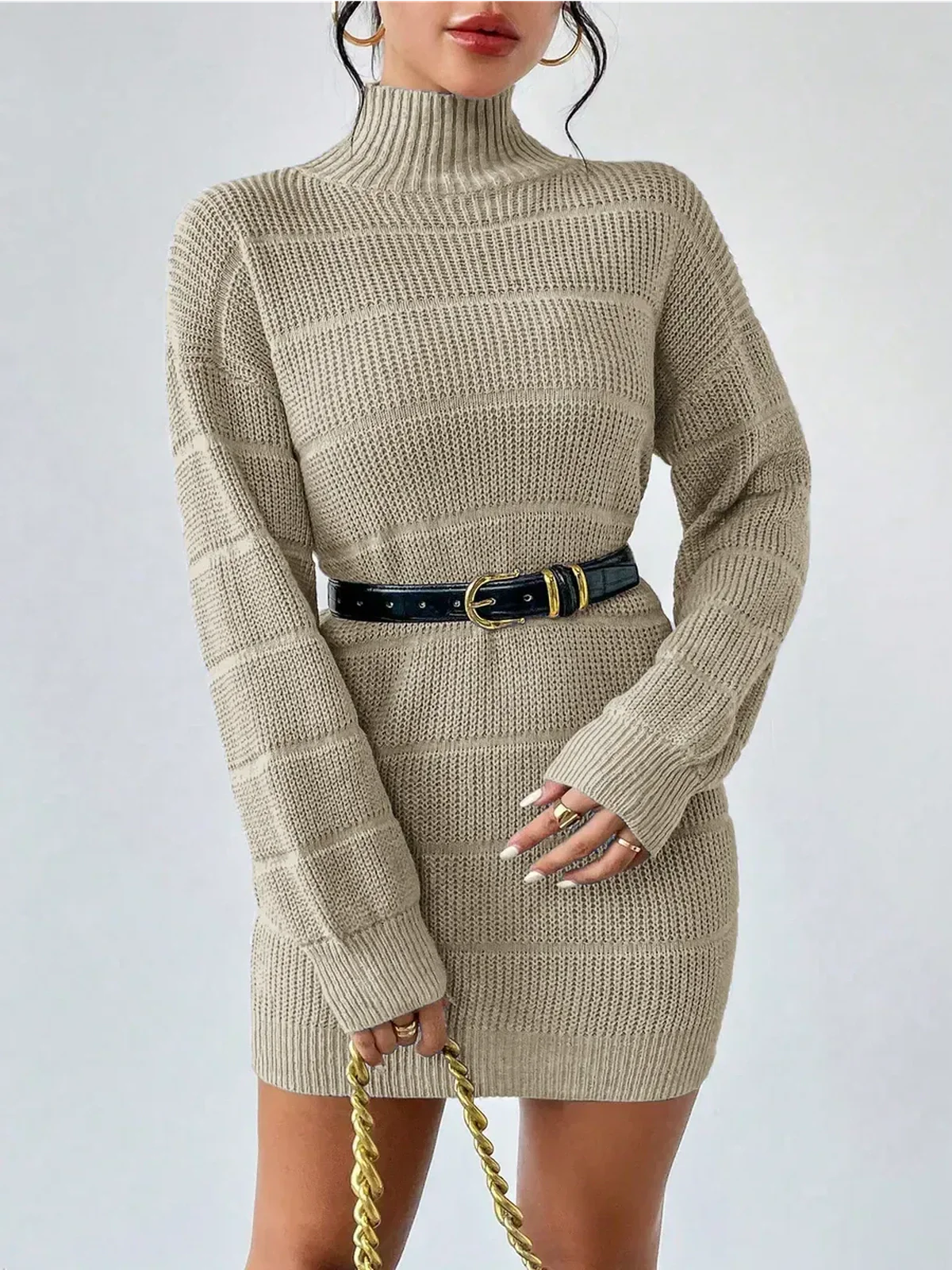 Beige long sleeve knit mini dress with mock neck, ribbed texture, and a stylish black belt.