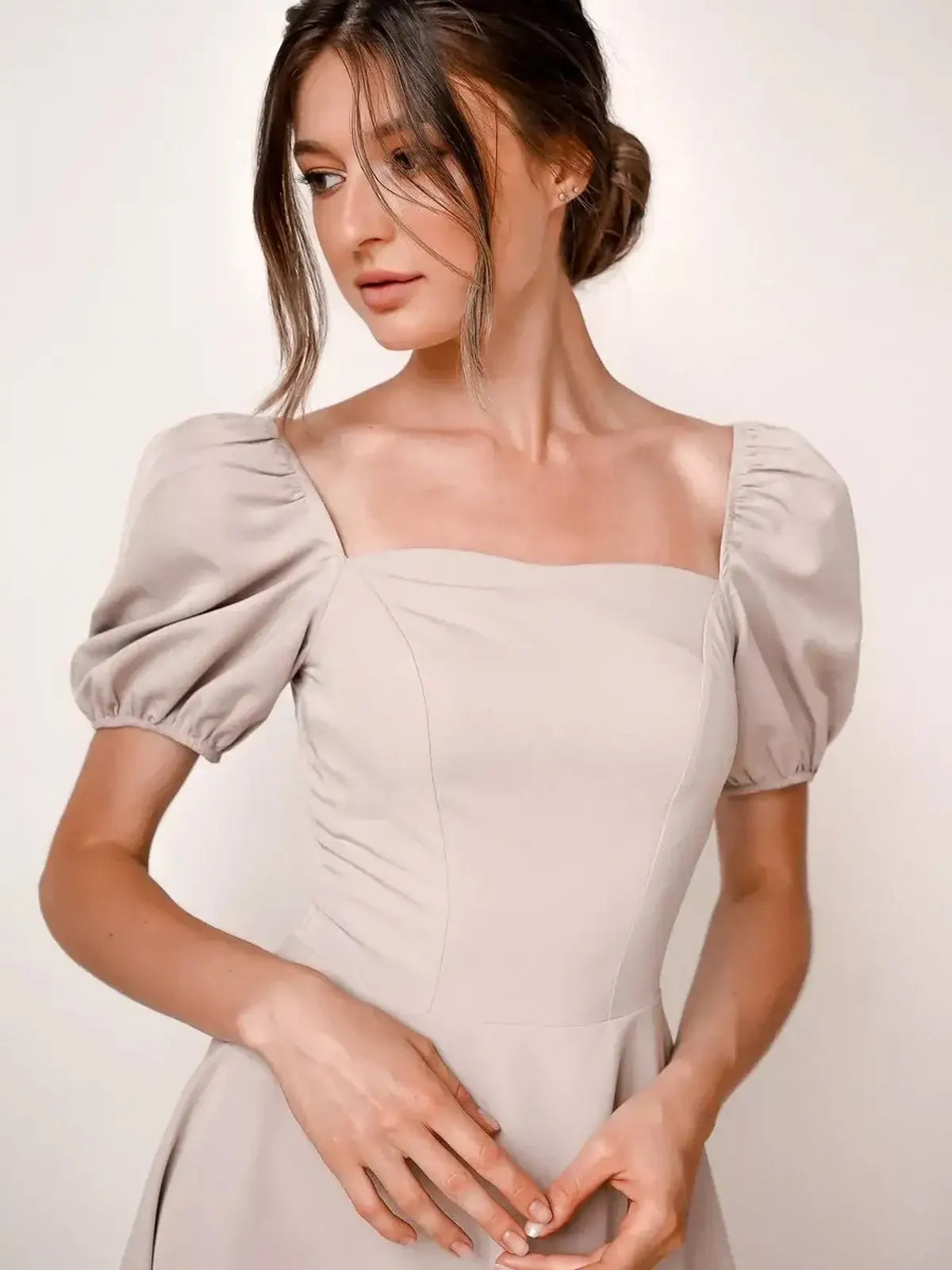 Elegant beige mini dress with puff sleeves, perfect for weddings, summer parties, and versatile day-to-evening wear.