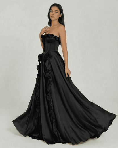 Noirelle Maxi Dress by Slimona - Strapless black dress with ruffle detail and elegant floor-length silhouette.