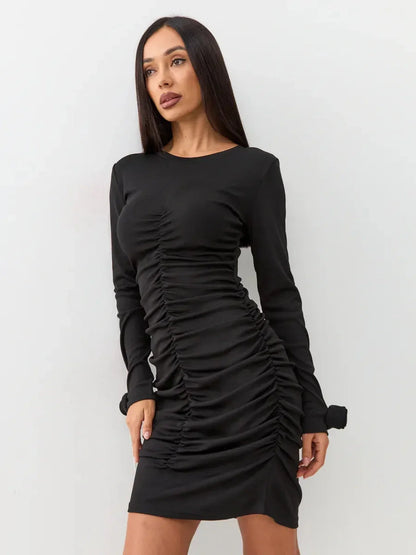 Elegant black dress with long sleeves and gathered ruching, perfect for evening events and formal occasions.