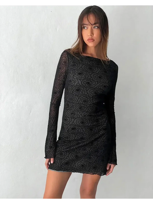 Black mini dress with long sleeves and floral design, perfect for cocktail parties and evening events.