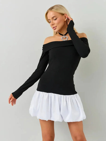 Black and white off-the-shoulder mini dress with fitted bodice and white bubble skirt, perfect for parties and weddings.
