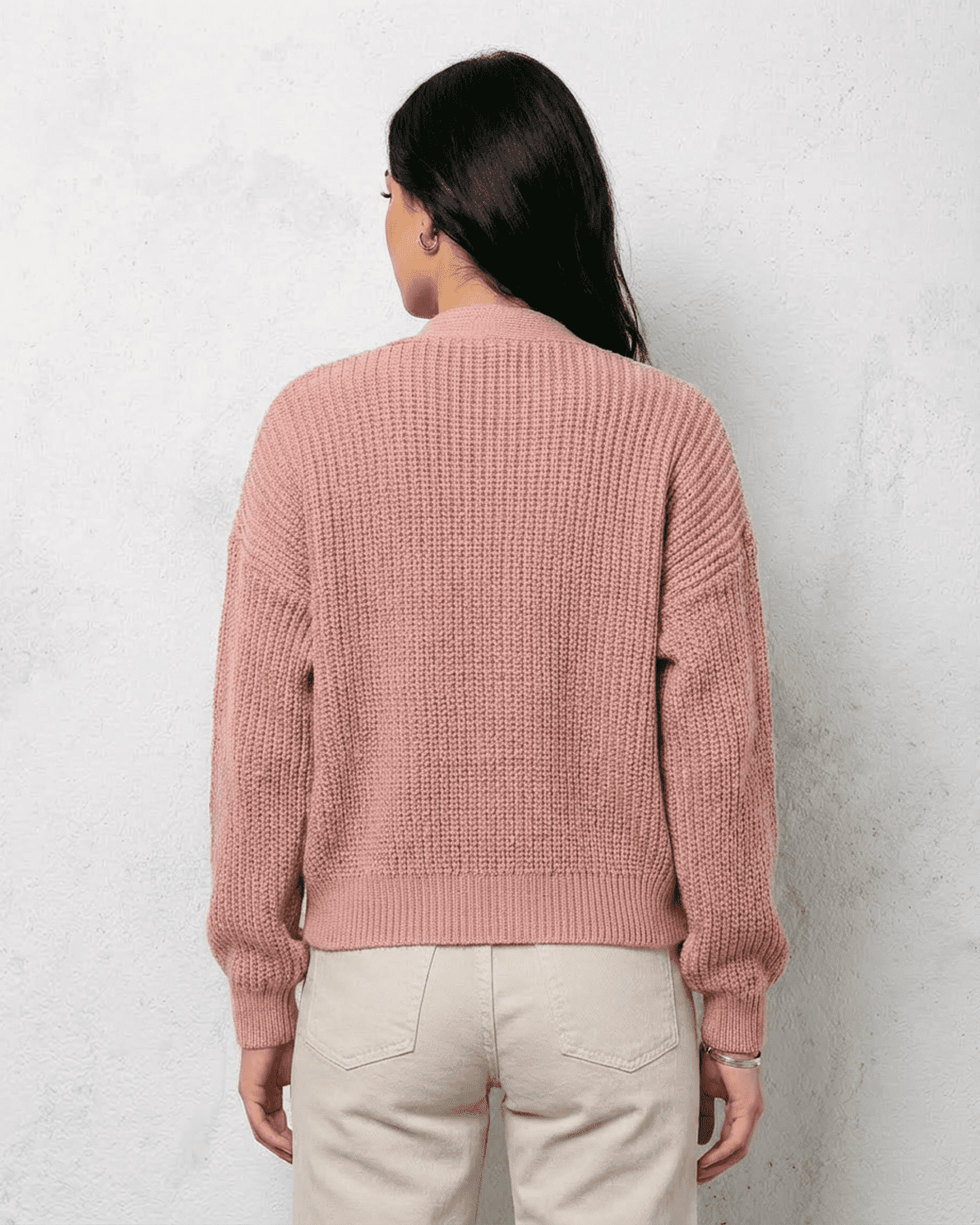 Blush Cardigan from Slimona, showcasing the soft pink knitwear's back view and relaxed fit design.