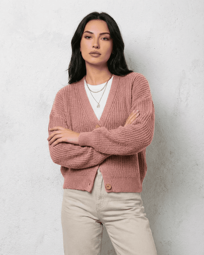 Blush Cardigan by Slimona featuring a soft pink knit, relaxed V-neck design, and loose fit perfect for layering.