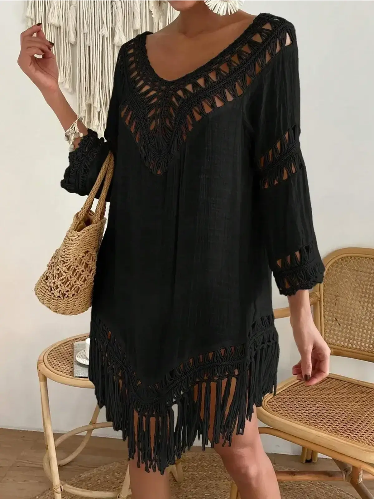 Boho Fringe black mini dress with openwork lace trim and fringe hem, ideal for summer occasions and casual outings.