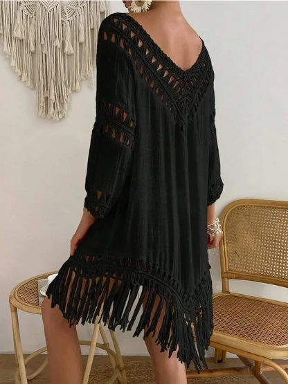 Stylish black Boho Fringe mini dress with lace trim and fringe hem, perfect for summer outings.