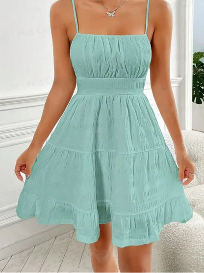 Breeze Tier Mini Dress in soft mint hue, featuring a ruched bodice and tiered skirt, perfect for summer outings.