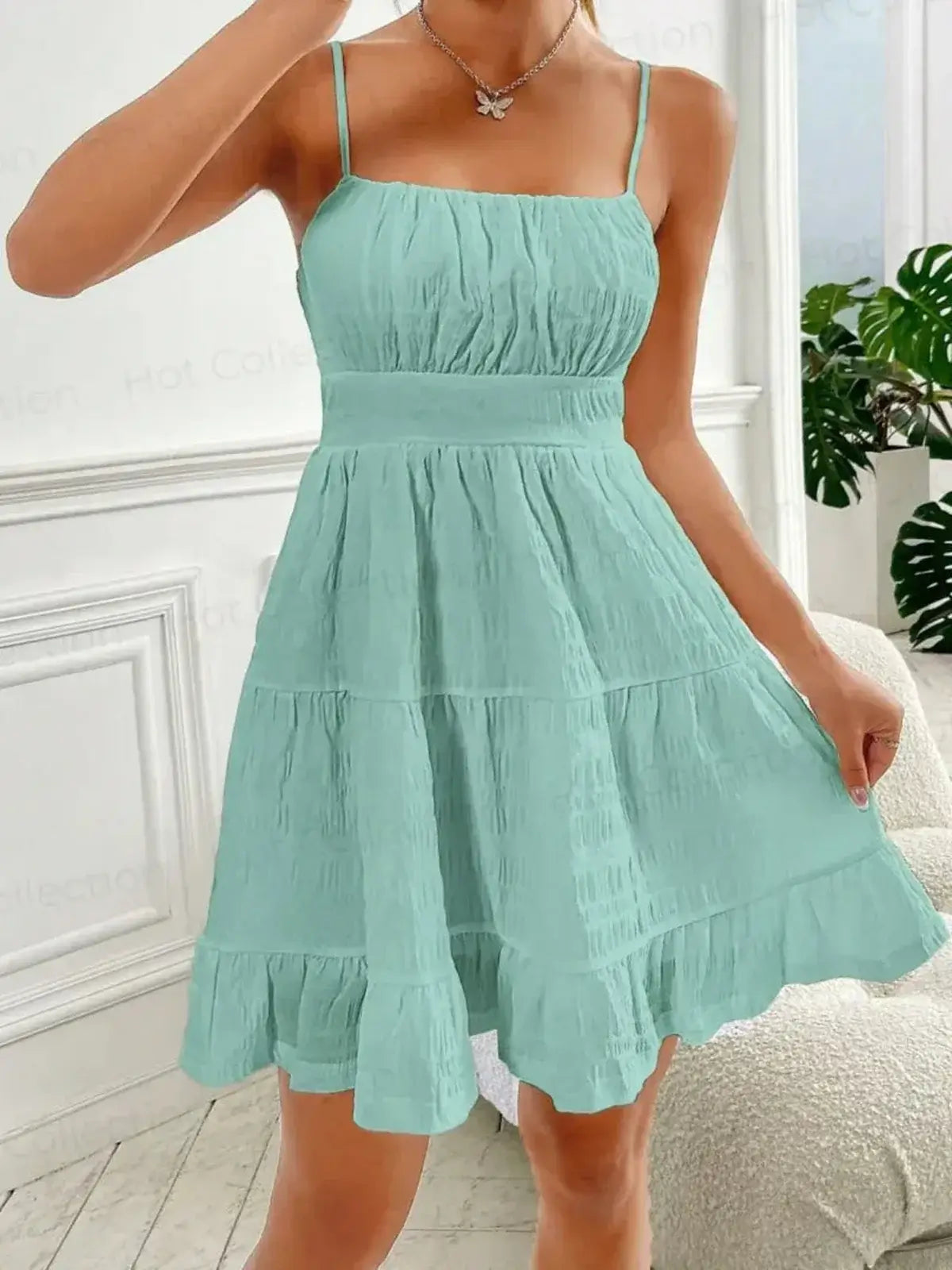 Breeze Tier Mini Dress in soft mint, featuring a ruched bodice and tiered flounce skirt, perfect for summer outings.