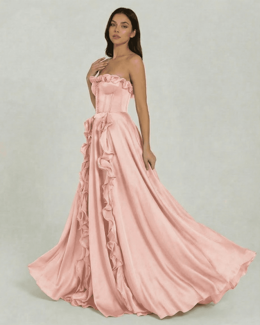 Rosalyn Maxi Dress by Slimona, a strapless pink maxi dress with ruffle detail and floor-length silhouette.