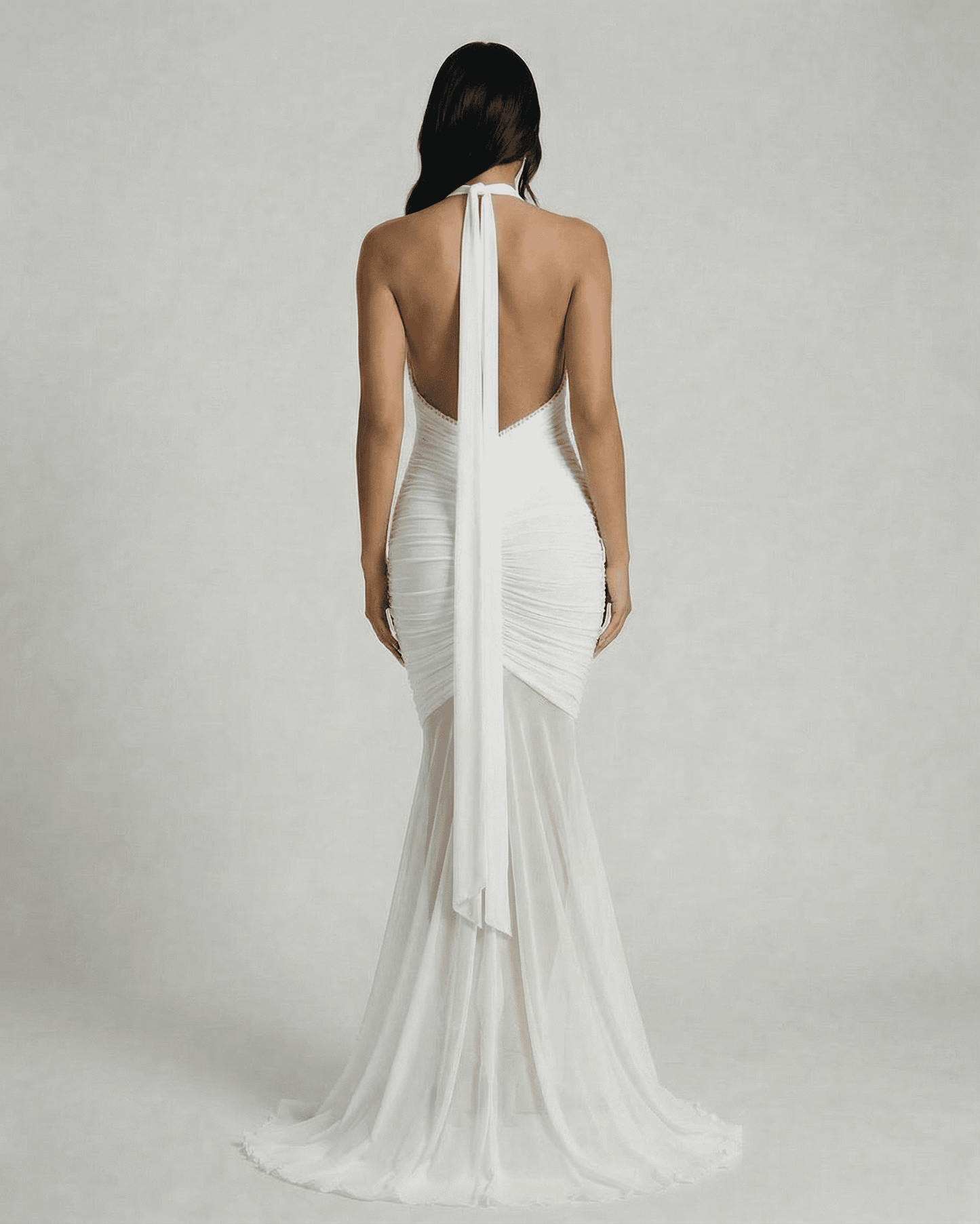 Back view of Slimona Ivory Maxi Dress, showcasing the elegant ruched design and flowing fabric.