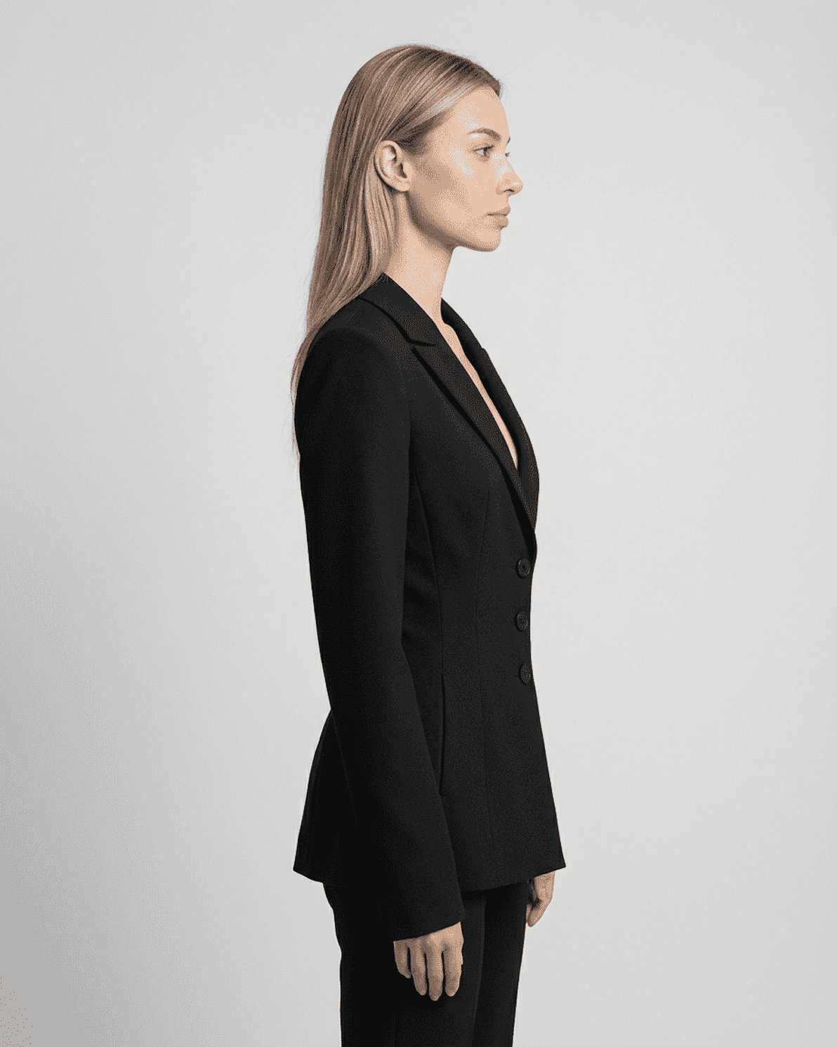 Celeste Blazer by Slimona shown from the side, featuring a fitted waist, V-neckline, and tailored silhouette.