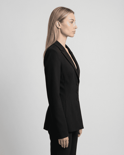 Celeste Blazer by Slimona shown from the side, featuring a fitted waist, V-neckline, and tailored silhouette.