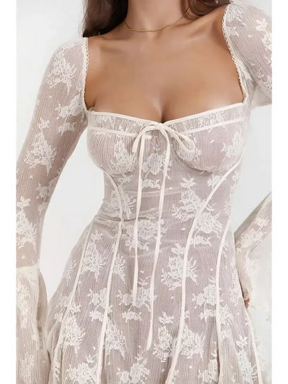 Celeste Lace white mini dress with structured corset bodice and bell sleeves, perfect for summer parties and weddings.