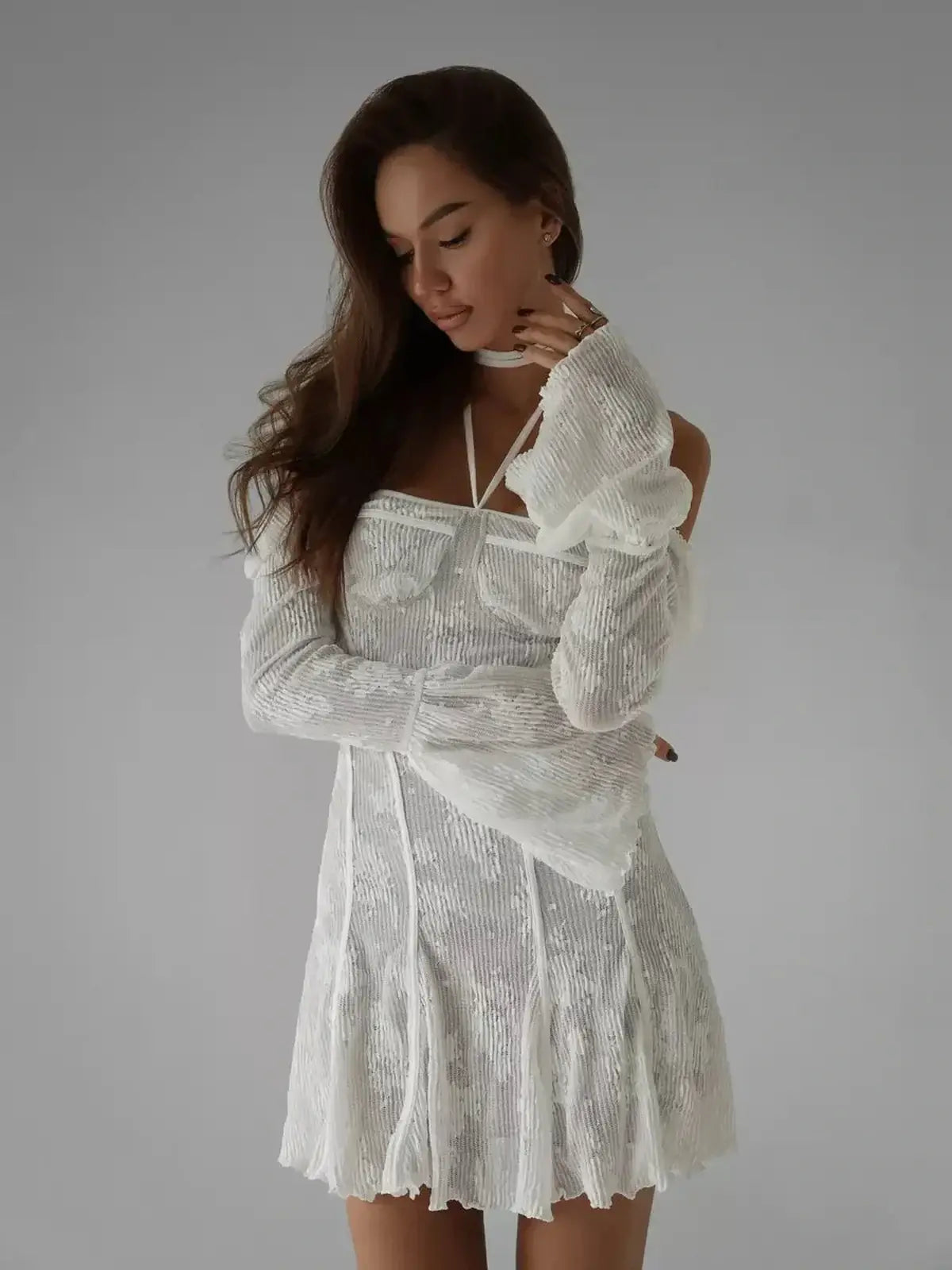 Celeste Lace white mini dress with off-the-shoulder sleeves and lace overlay, perfect for summer weddings or formal events.