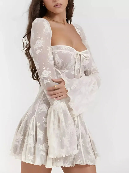 Celeste Lace white mini dress with off-the-shoulder long bell sleeves, perfect for wedding guest or summer occasions.