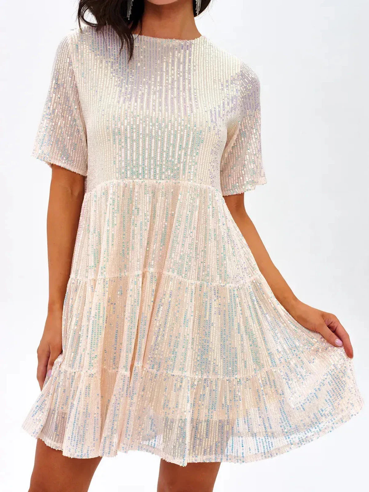 Sparkly champagne pop mini dress with tiered ruffle silhouette, perfect for parties and celebrations.