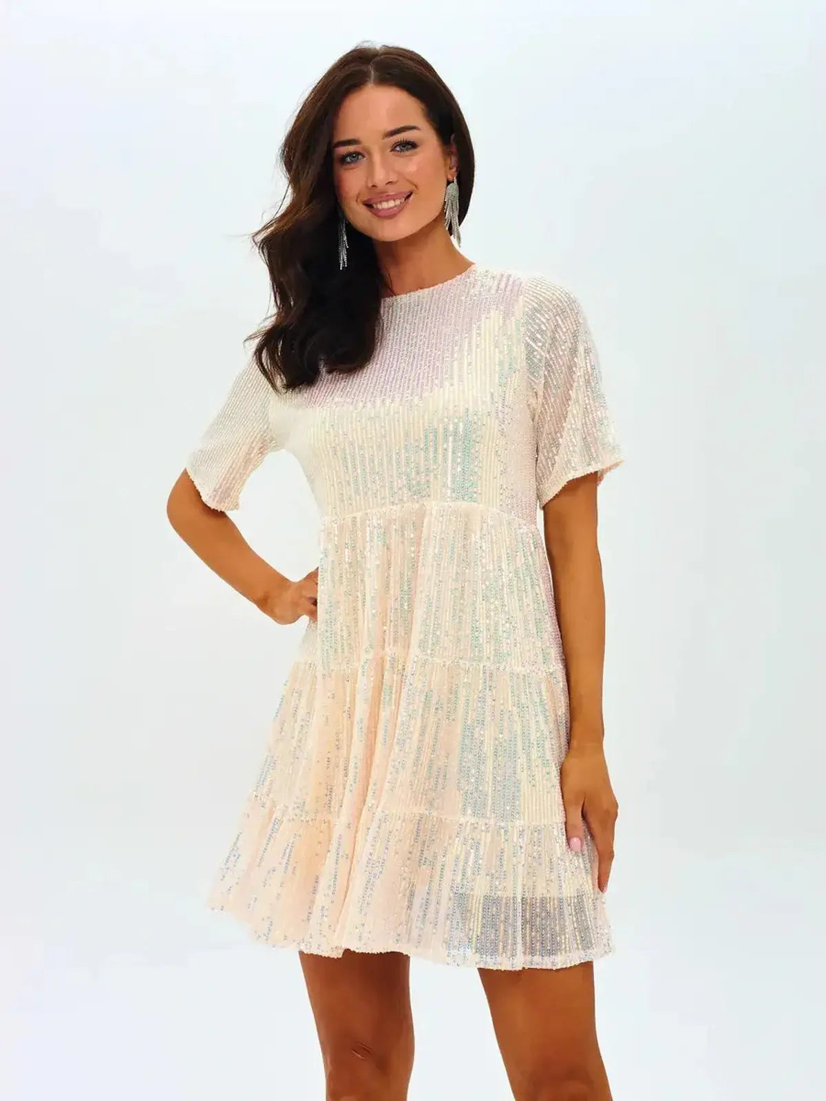 Sparkling mini dress in golden champagne hue with tiered ruffle silhouette, perfect for summer parties and weddings.