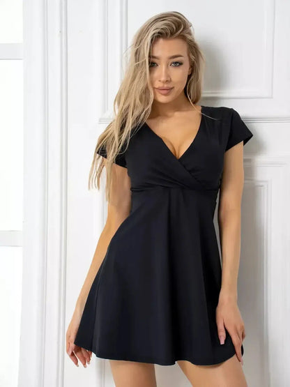 Charming black mini dress with deep V-neckline, perfect for cocktail parties and summer outings.