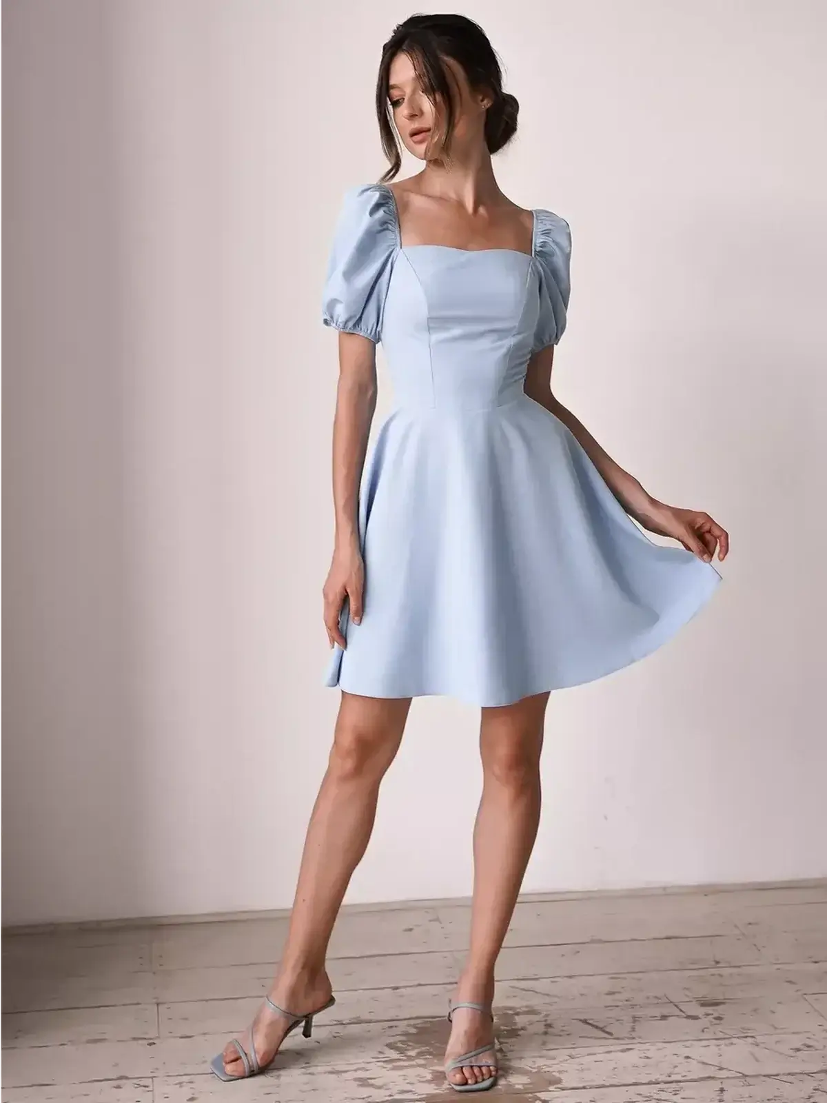 Light blue mini dress with puff sleeves and A-line skirt, perfect for summer weddings and parties.