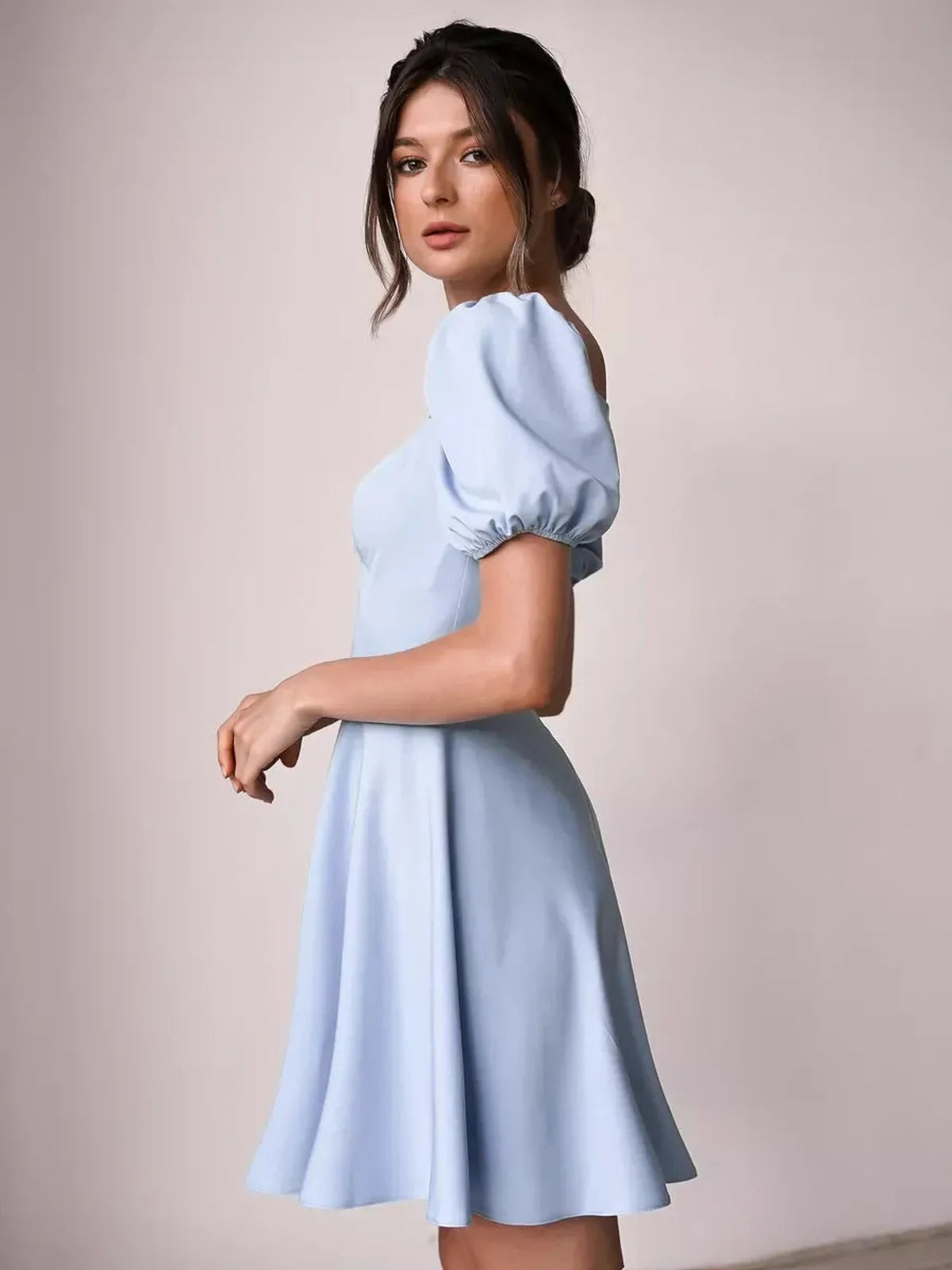 Elegant light blue mini dress with puff sleeves, perfect for summer weddings, parties, or casual outings.