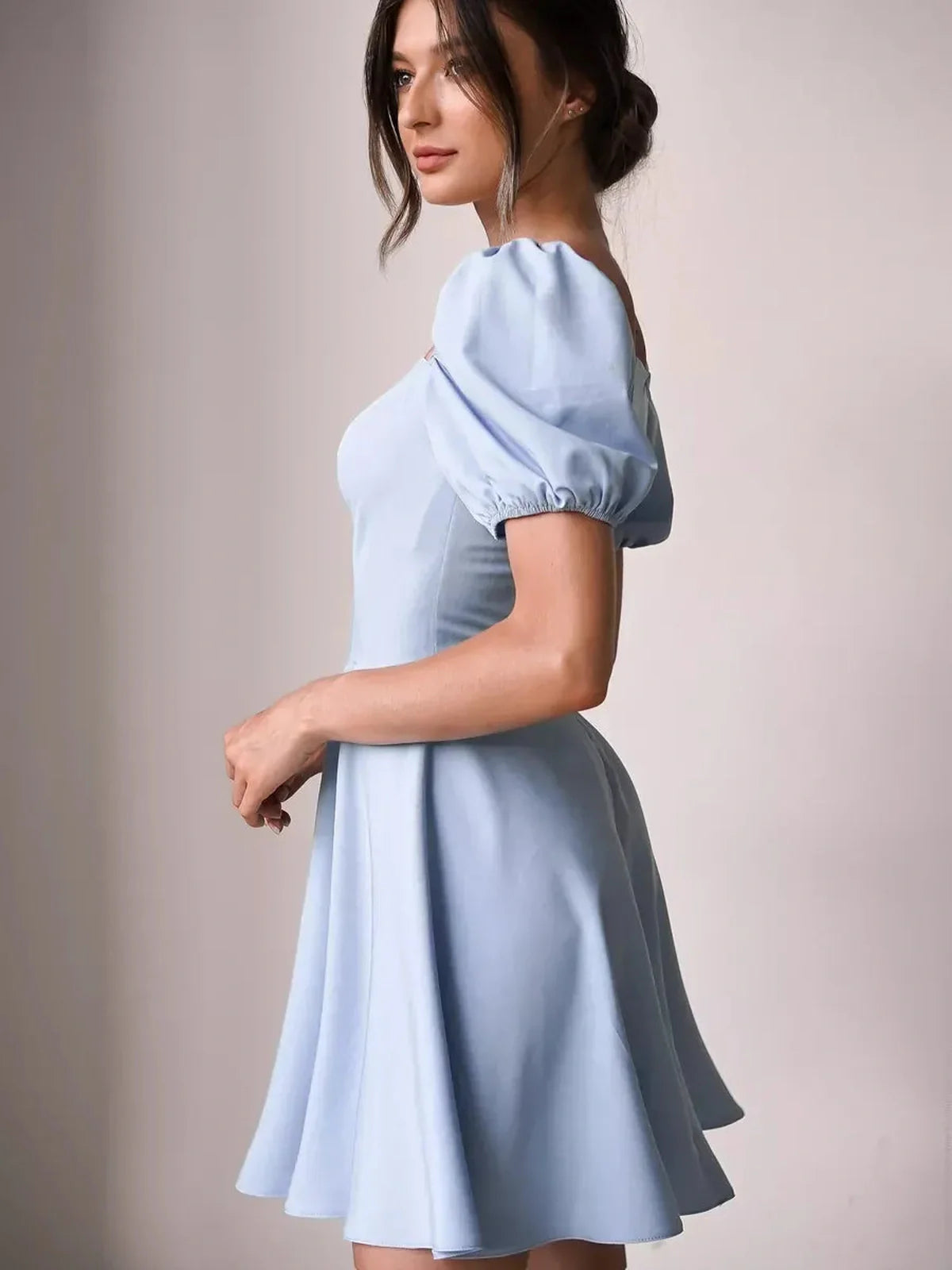 Light blue mini dress with puff sleeves, perfect for summer parties and weddings.