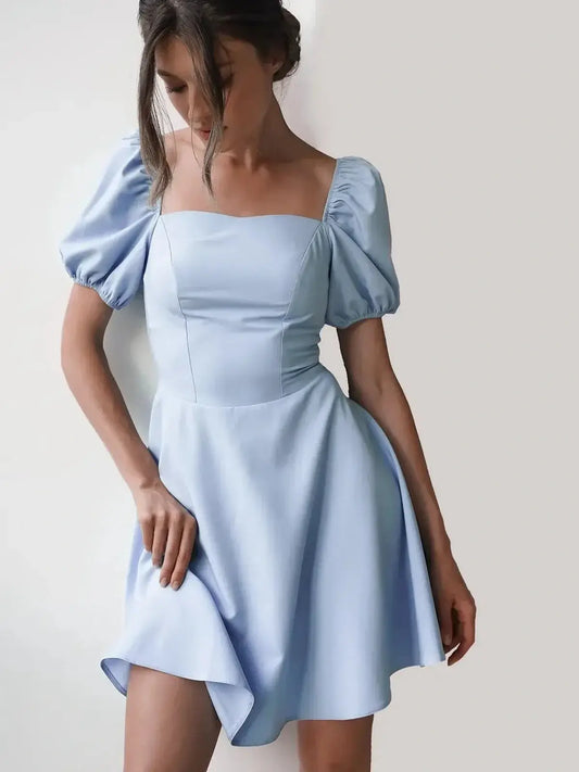Light blue mini dress with puff sleeves and square neckline, perfect for summer weddings or cocktail parties.